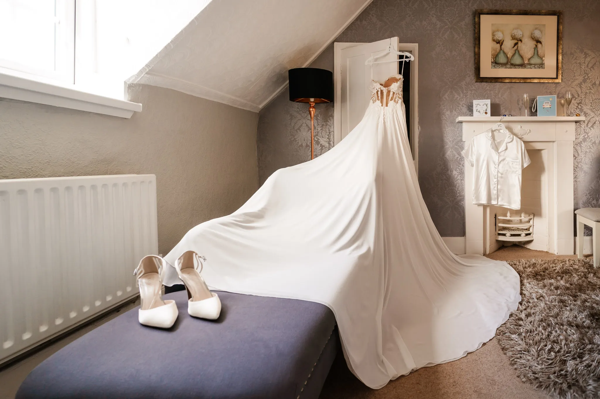 Wedding dress and shoes in a Springfield House bedroom